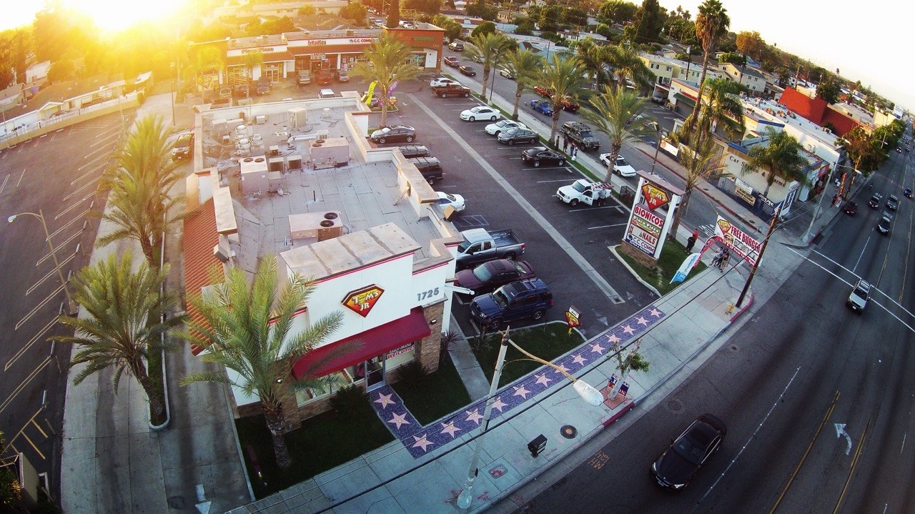 Tom's Jr. Burgers storefront in Compton on N. Long Beach Blvd at sunset