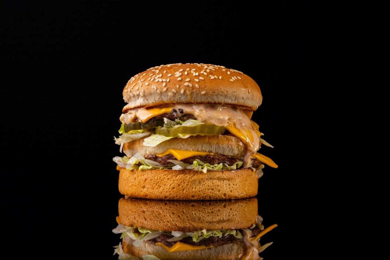 Tom's Jr. double cheeseburger with lettuce, pickles, and special sauce