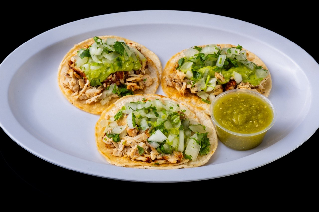 Tom's Jr. street tacos with chicken, onion, cilantro, and salsa verde